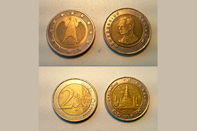 Тайские баты и монеты в два евро